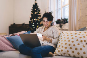 woman using computer to search for job during holidays
