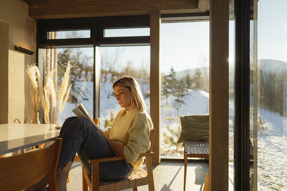 Woman reads a book on decision making