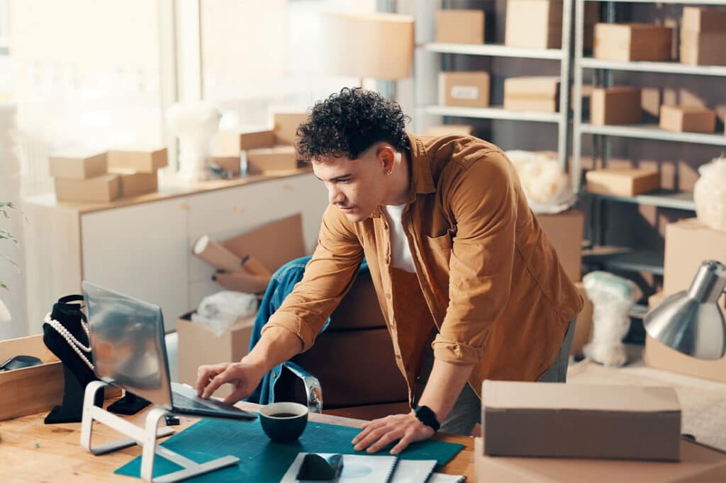 Logistics, laptop and man in office for ecommerce