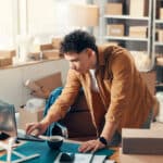 Logistics, laptop and man in office for ecommerce