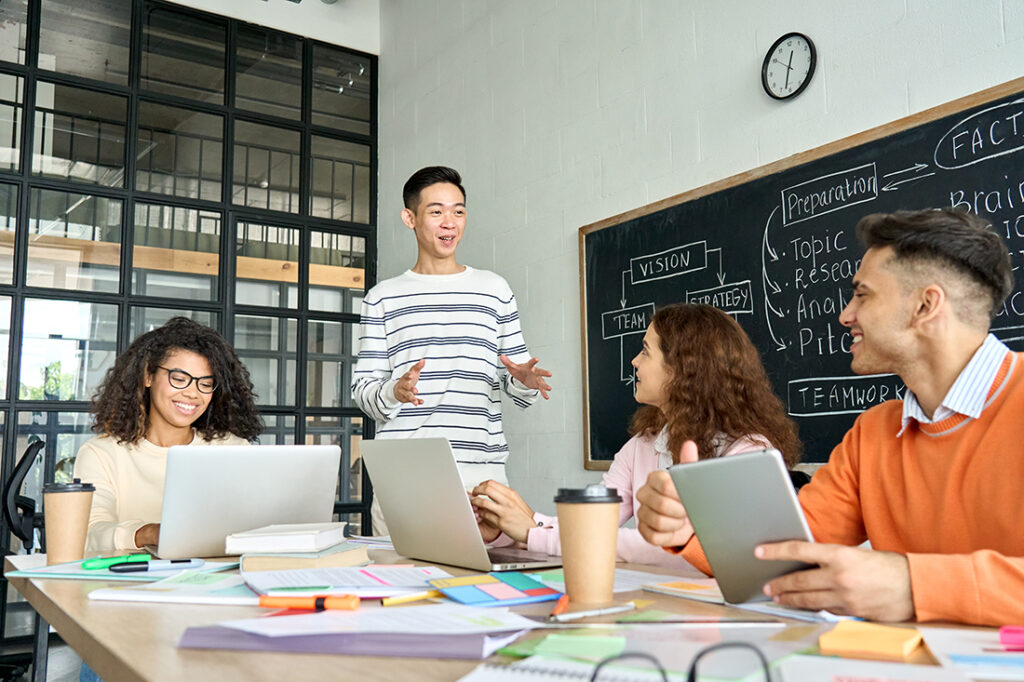A group of coworkers brainstorm strategies to build a brand