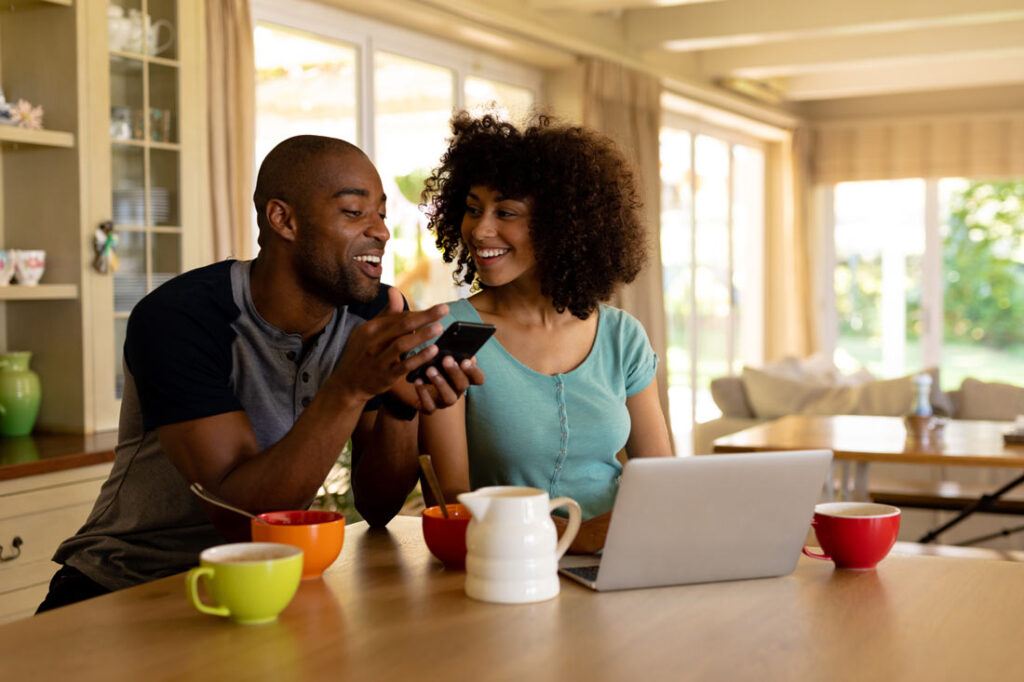 Couple planning their zero-based budget together in their kitchen