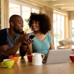 Couple planning their zero-based budget together in their kitchen