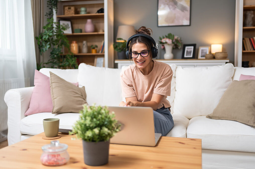 Young woman talking on video call with her psychotherapist doctor after online therapy session