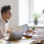 Two coworkers disagree in a workplace confrontation