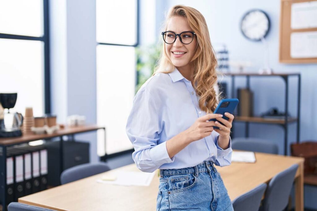 happy woman holding phone