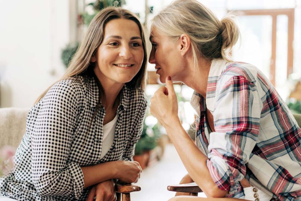 two women sharing gossip