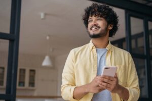 man using mint app on phone