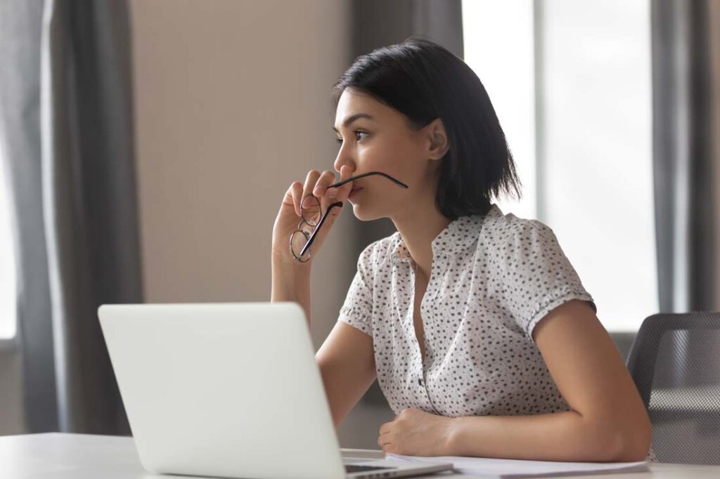 woman thinking about being a boomerang employee