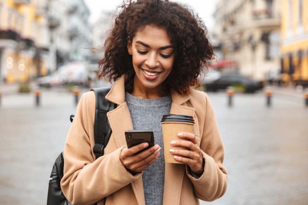 millennial woman using budgeting tool on phone