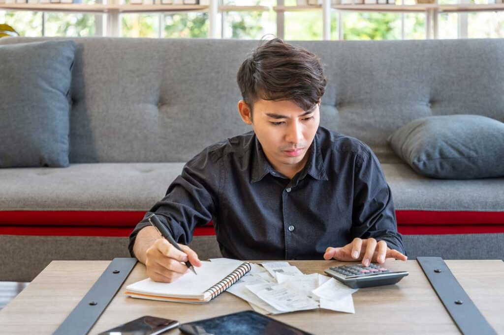 younger man making a plan to manage his money