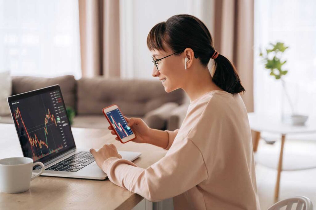 woman looking at stock market investing trends