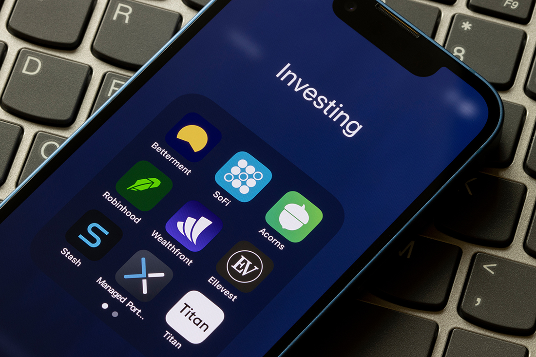Assorted investing, robo-advisor apps are seen on an iPhone - Betterment, SoFi, Acorns, Robinhood, Wealthfront, Ellevest, Stash, Axos Invest Managed Portfolios, and Titan.