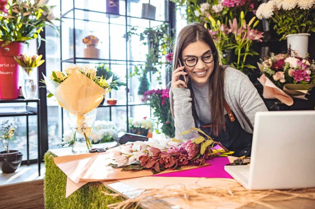 flower shop entrepreneur on the phone