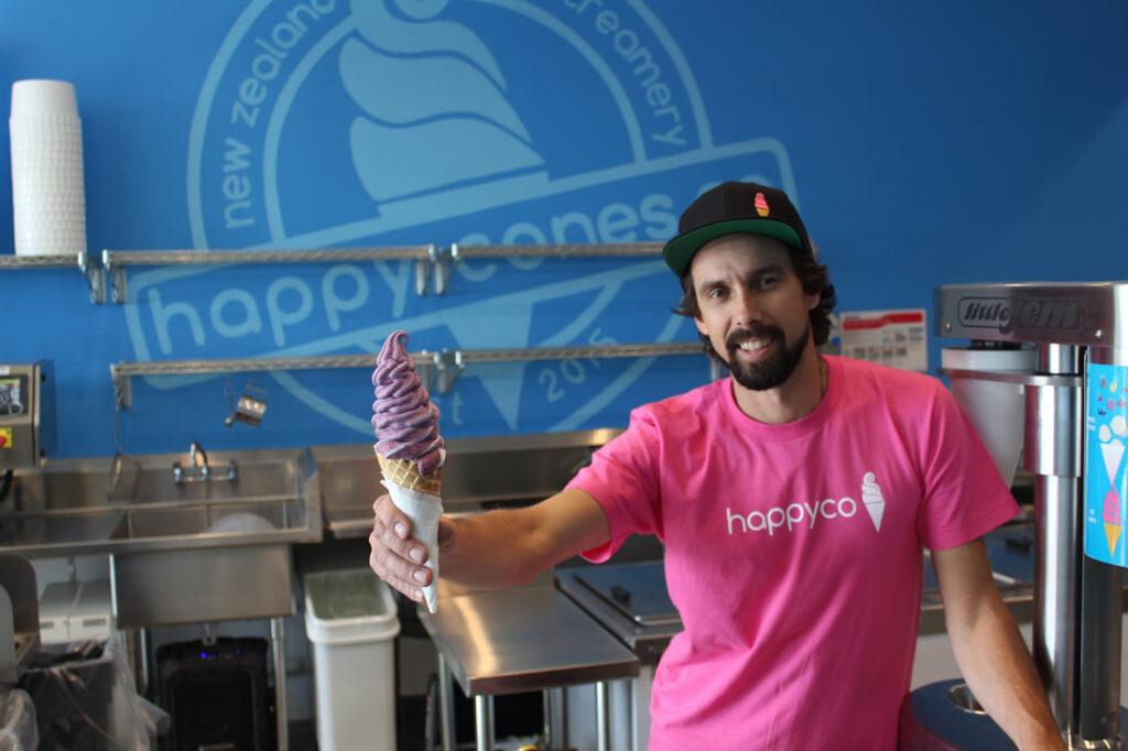 Happy Cones founder Hap Cameron holding a New Zealand-style ice cream cone