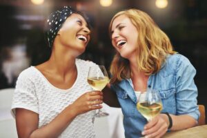 two women drinking nonalcoholic wine