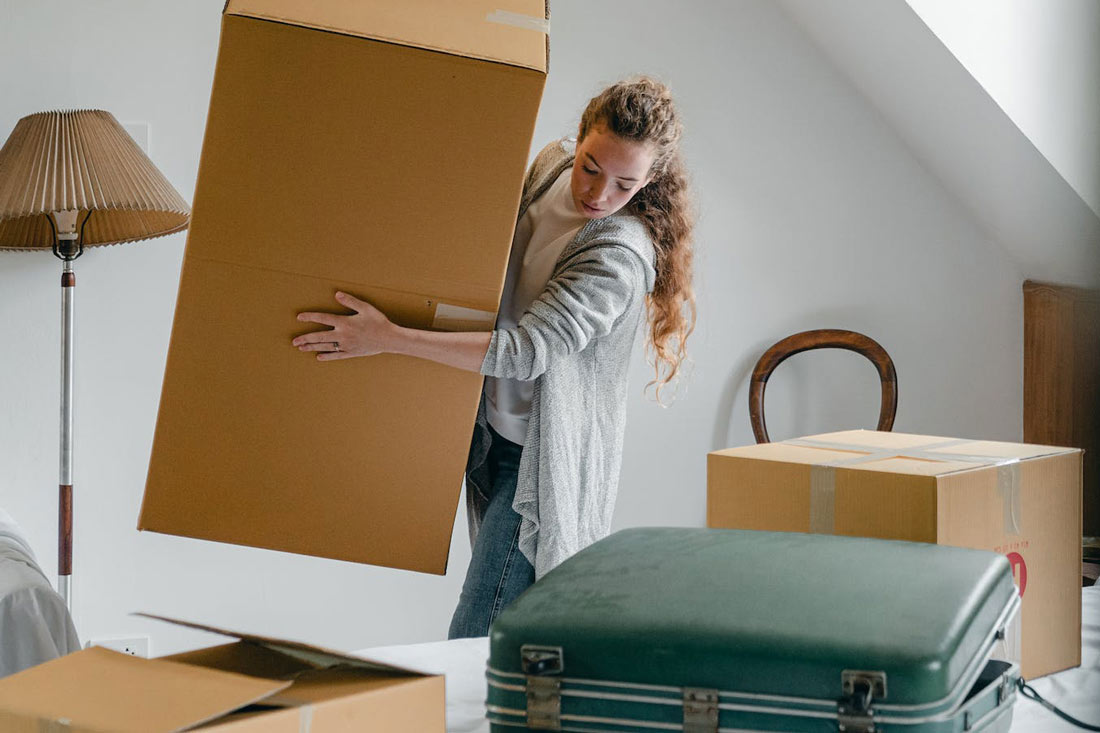 woman packing apartment in preparation for a move