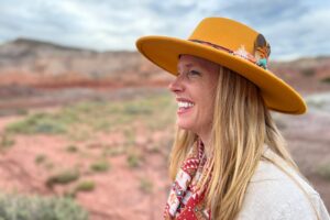 Side profile of Darley Newman standing out in Ghost Ranch in Santa Fe, New Mexico