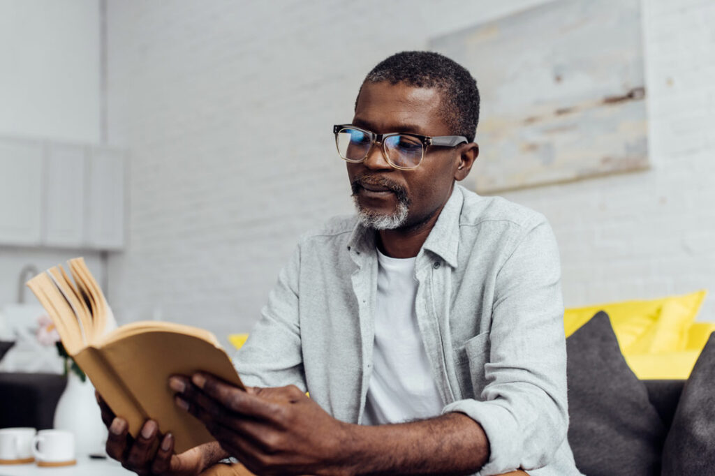 Mature Black businessman reading the best time management books