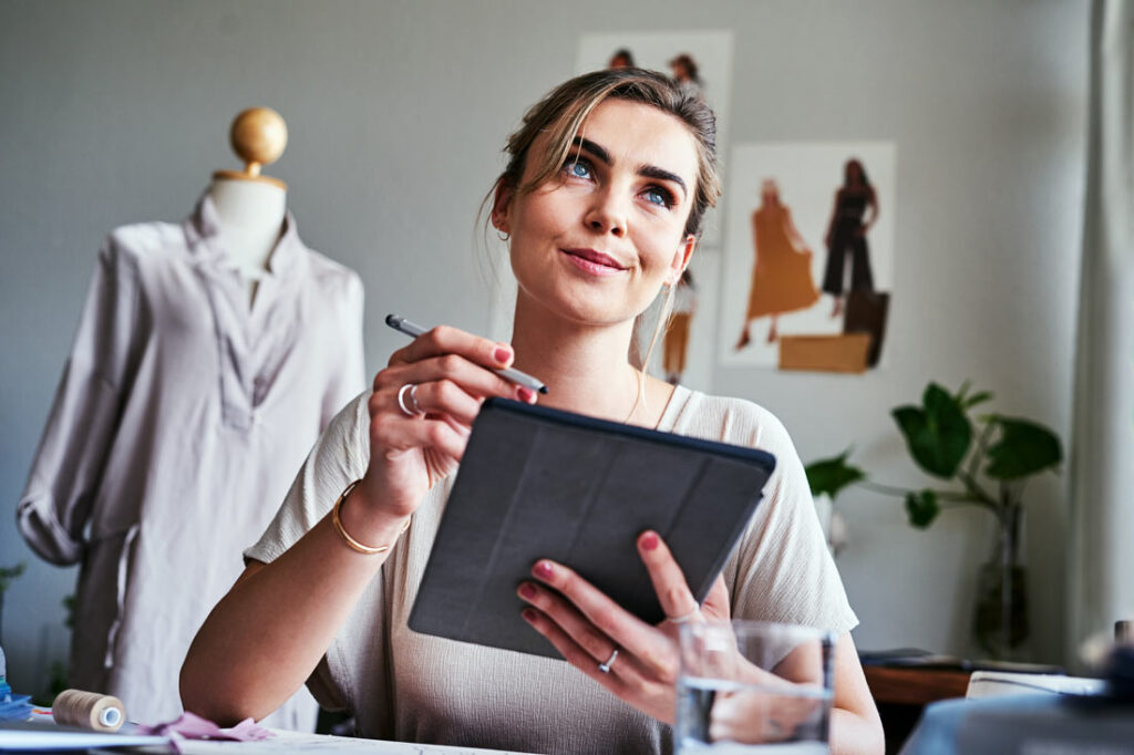 Business woman planning her professional development goals in a fashion design studio