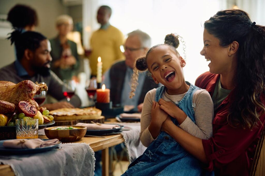 Happy mother and child at an inclusive holiday potluck