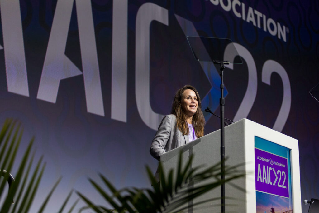 Joanne Pike, DrPH, president and CEO of Alzheimer’s Association on stage explaining what they do