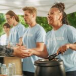 People volunteering at a food bank on thanksgiving showing one of many thanksgiving volunteer opportunities