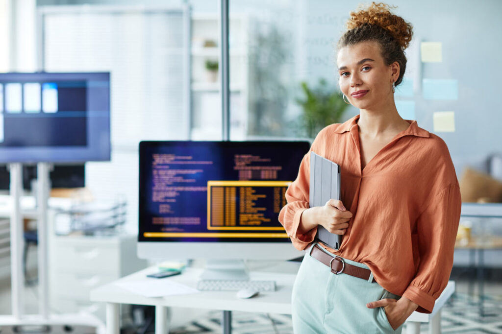 AI consultant standing in front of her workspace