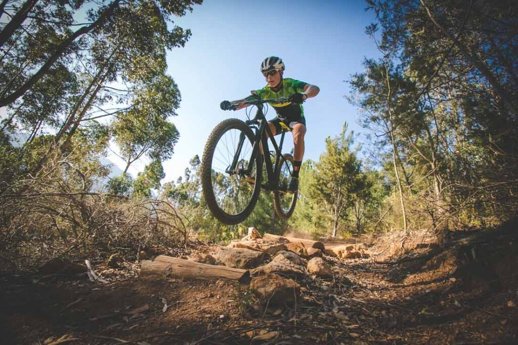 Mature man riding a mountain bike learning to face his fears