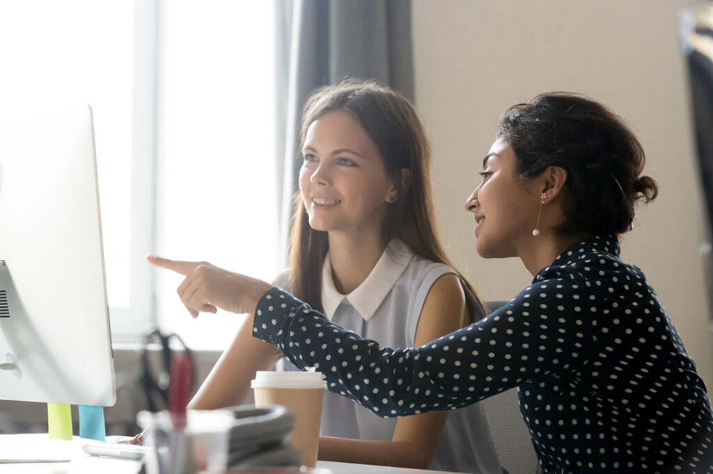 Woman mentoring another woman