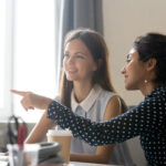 Woman mentoring another woman