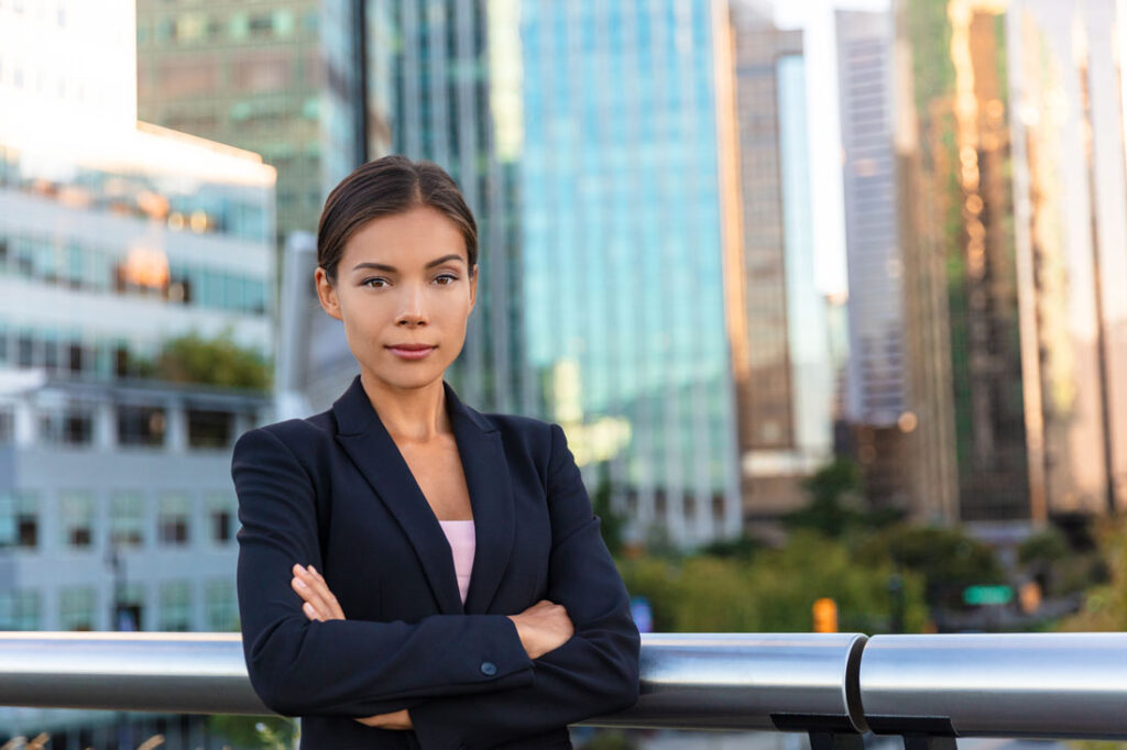 Fearless woman in front of city skyline