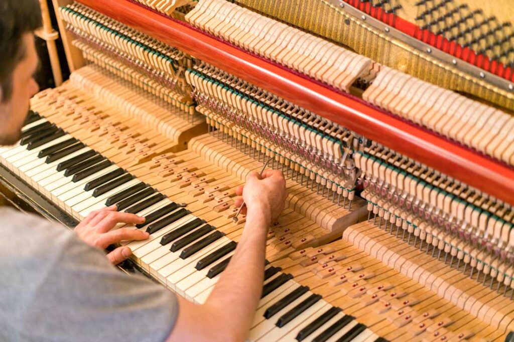piano technician at work to exemplify niche careers you didn't know existed