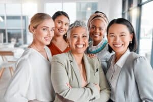 A multicultural group of women showing the benefits of DEI allyship in the workplace