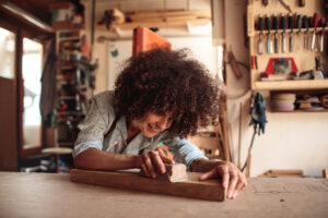 Woman working on a woodshopping hobby
