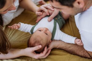 mother, father and new baby enjoy paid family leave