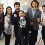 diverse group of staff being loud at work