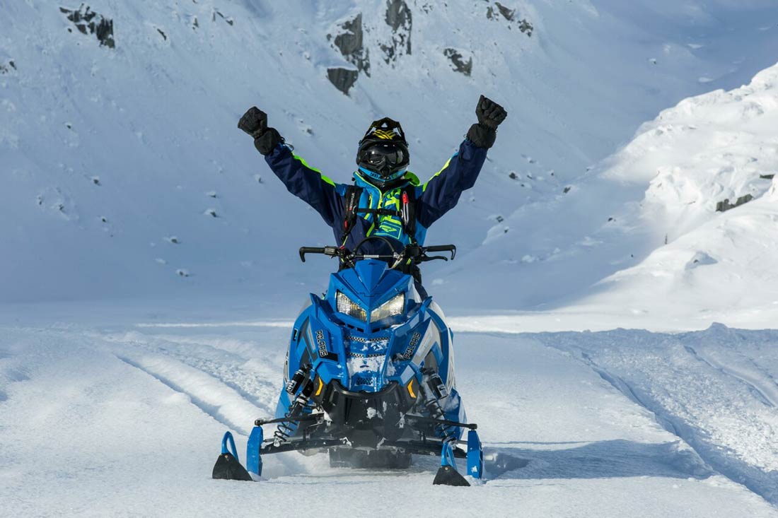 triumphant snowmobile rider from revv roam