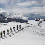 group of people hiking in the snow