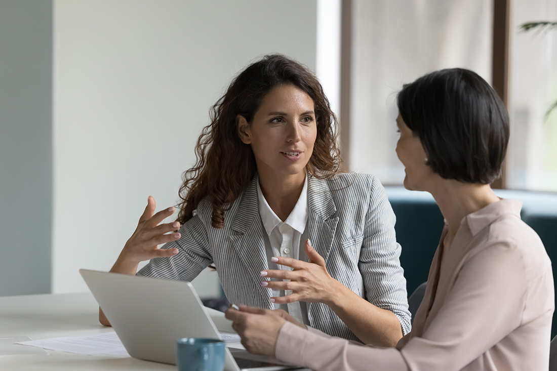 Woman communicates effectively with a colleague