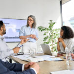 Business leader and employees having a meeting at the office