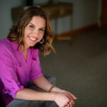 Erica Anderson Rooney headshot in pink blouse