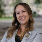 Headshot of Amanda Webster in a grey suit jacket