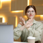 women in the office saying "stop, that's not my job"