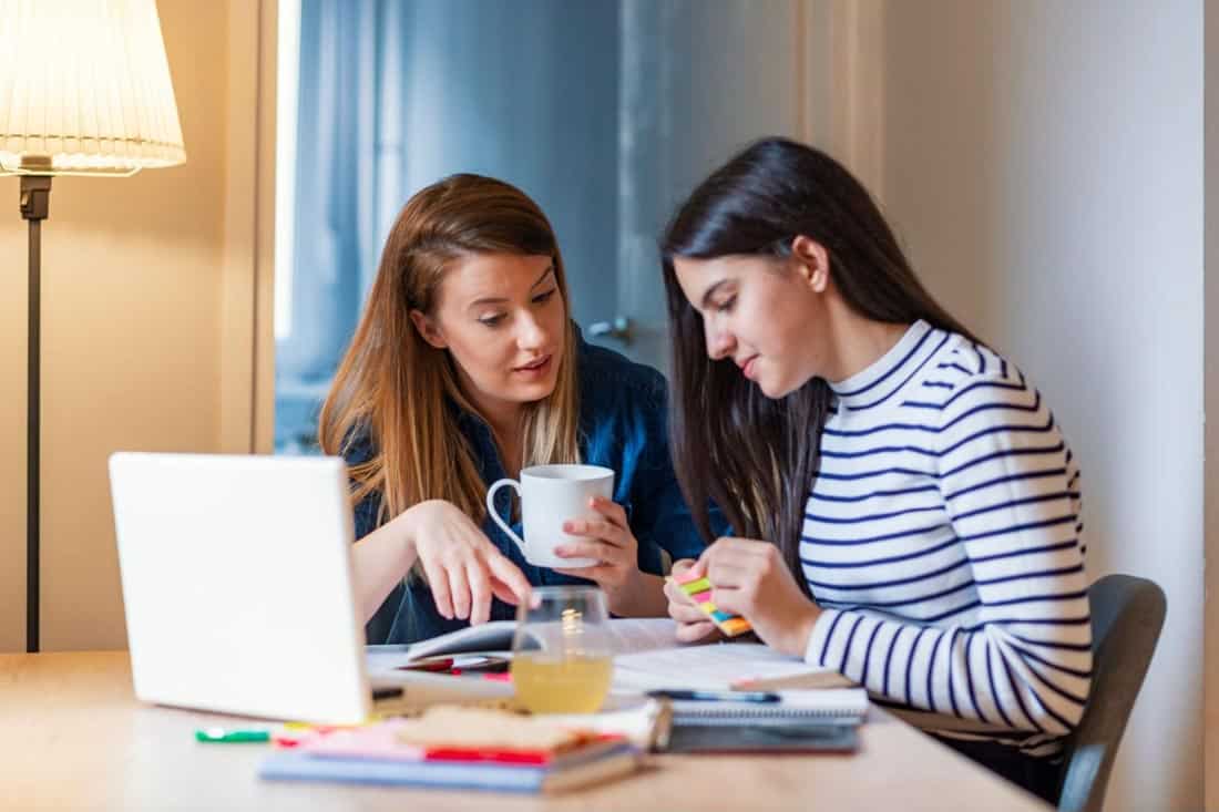 A mother helps her child with the college guidance network.