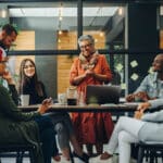 Group of business professionals working as a team in a diverse workplace