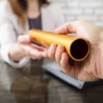 two business people passing the baton of leadership with succession planning