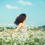 Young happy girl celebrating the beginning of springtime and April