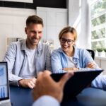 A financial planner meeting with a young couple
