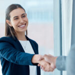 Colleagues display mutual respect by shaking hands